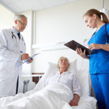 Doctor and nurse with patient represents Industries We Serve at Tomorrow Future Consulting