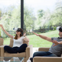 Couple participating in virtual reality represents Industries We Serve at Tomorrow Future Consulting